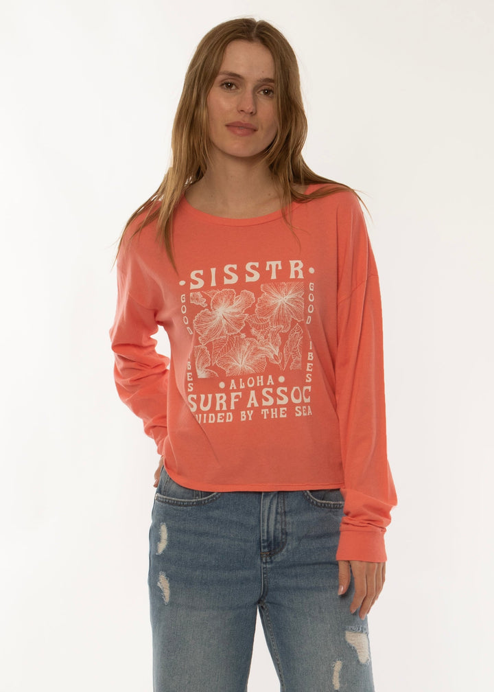 Sisstrevolution Good Vibes LS Knit Tee in coral, featuring a surf-inspired graphic.