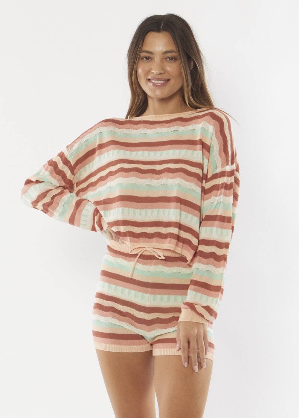 Rust-colored Sisstrevolution Choppy Friday Knit Sweater with pastel stripes.