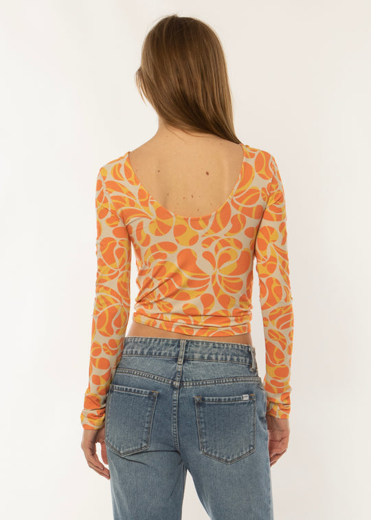 Sisstrevolution Skyscape LS Knit in coral with vibrant abstract print, back view.