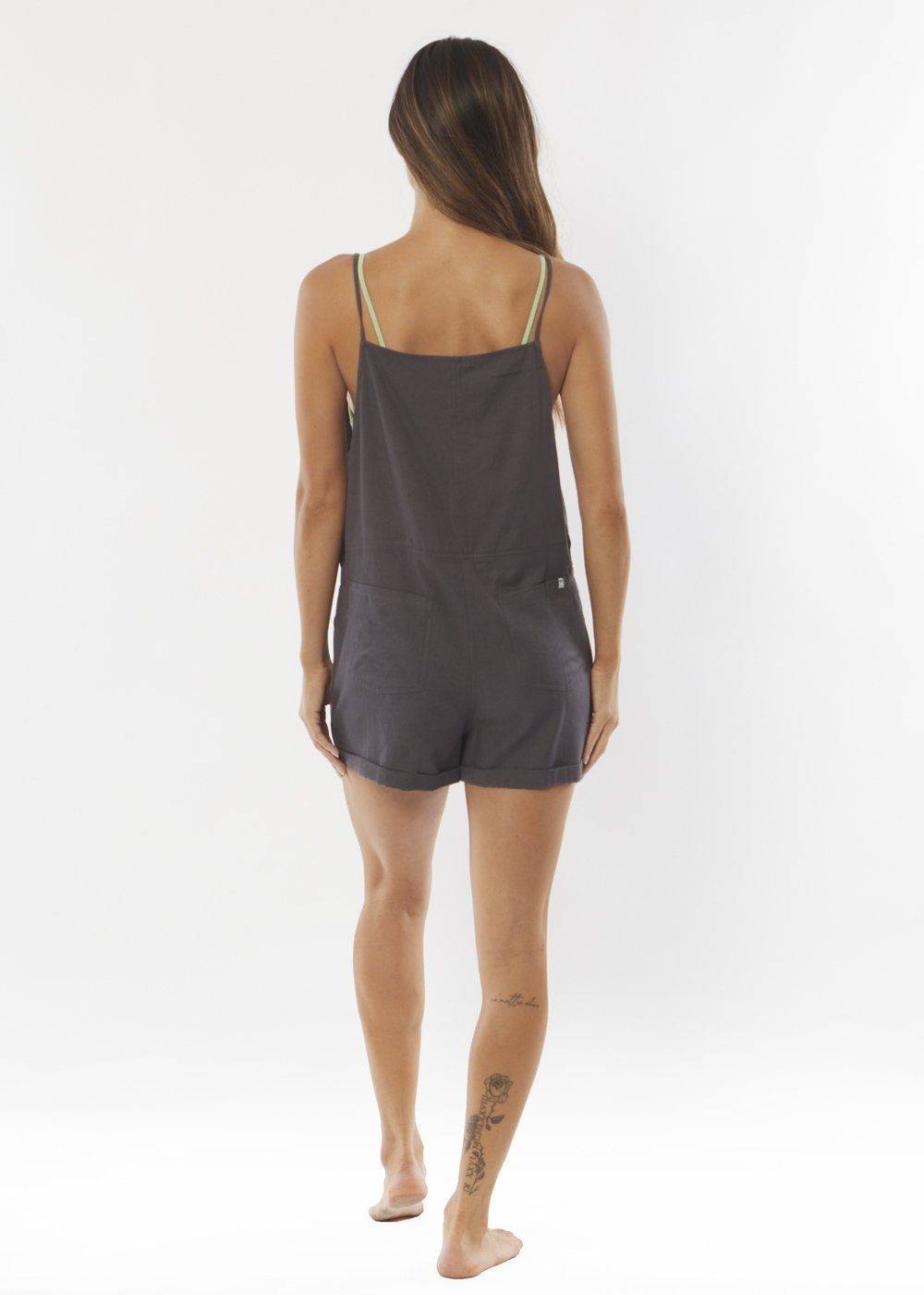 Sisstrevolution Dig It Woven Romper in Black Fade, back view.