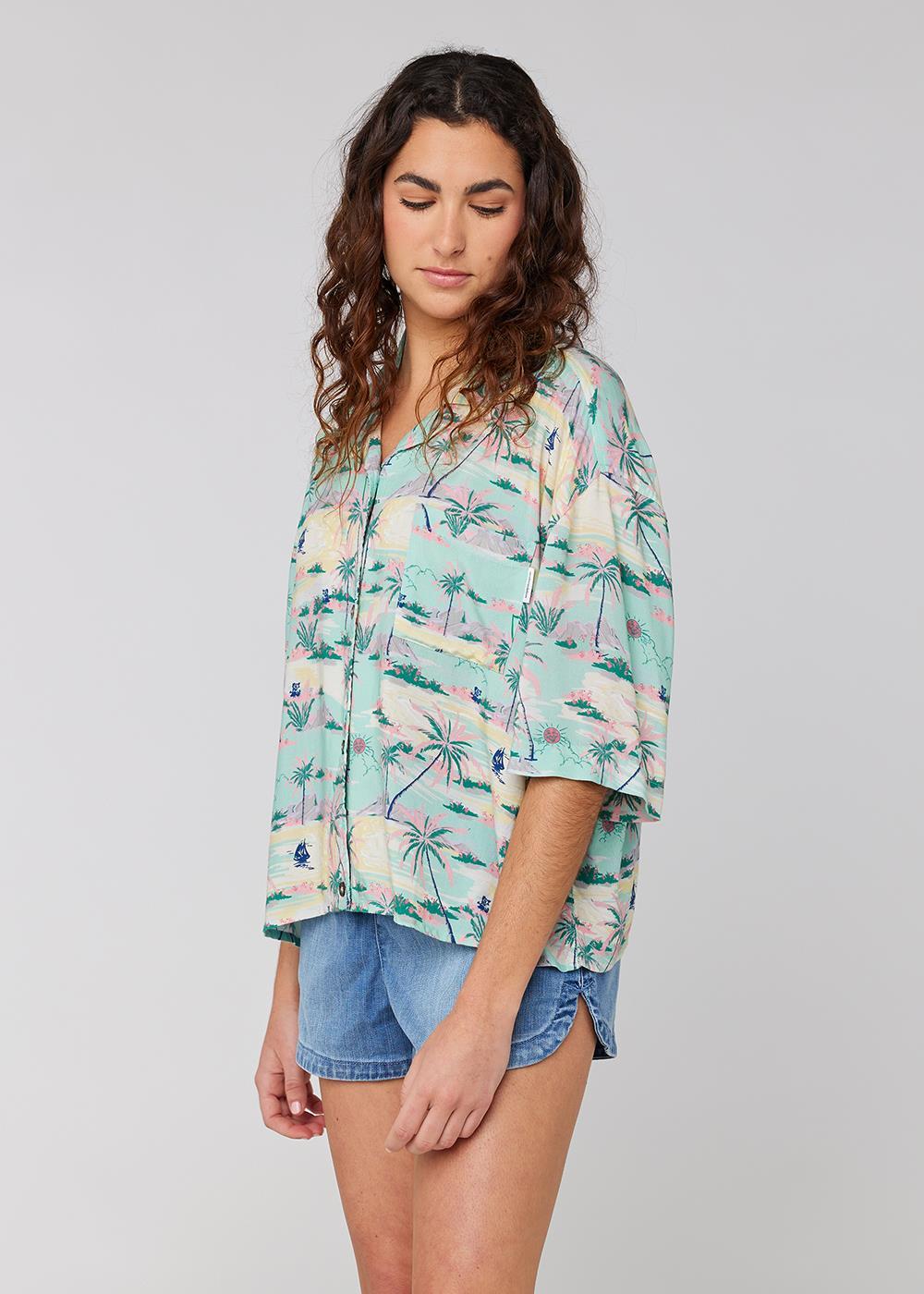 Sisstrevolution Honolulu Shirt in Light Jade with tropical print, front view.