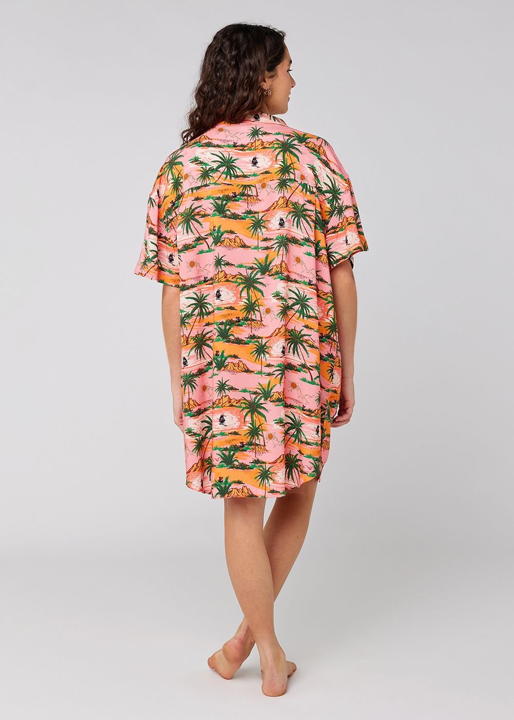 Sisstrevolution Hula Dress in pink hibiscus print, back view.